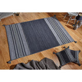 Grey kilim rug styled in a living room