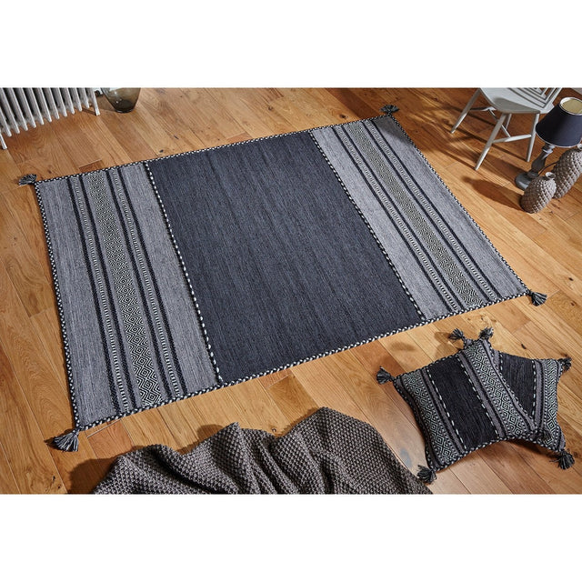 Grey kilim rug styled in a living room