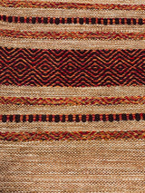 Beige cotton kilim rug in bedroom setting