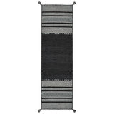Grey kilim rug styled in dining room