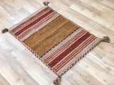 Beige cotton kilim rug texture detail