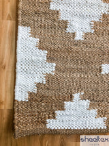 Diamond pattern jute rug corner detail