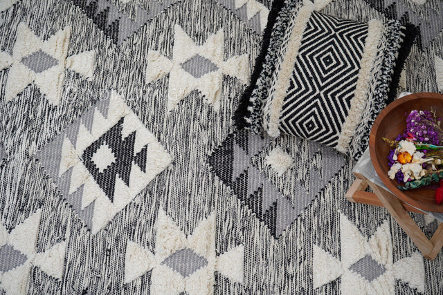 Abstract grey wool area rug flat lay