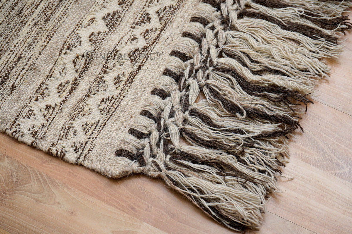 Farmhouse kilim rug under a wooden table