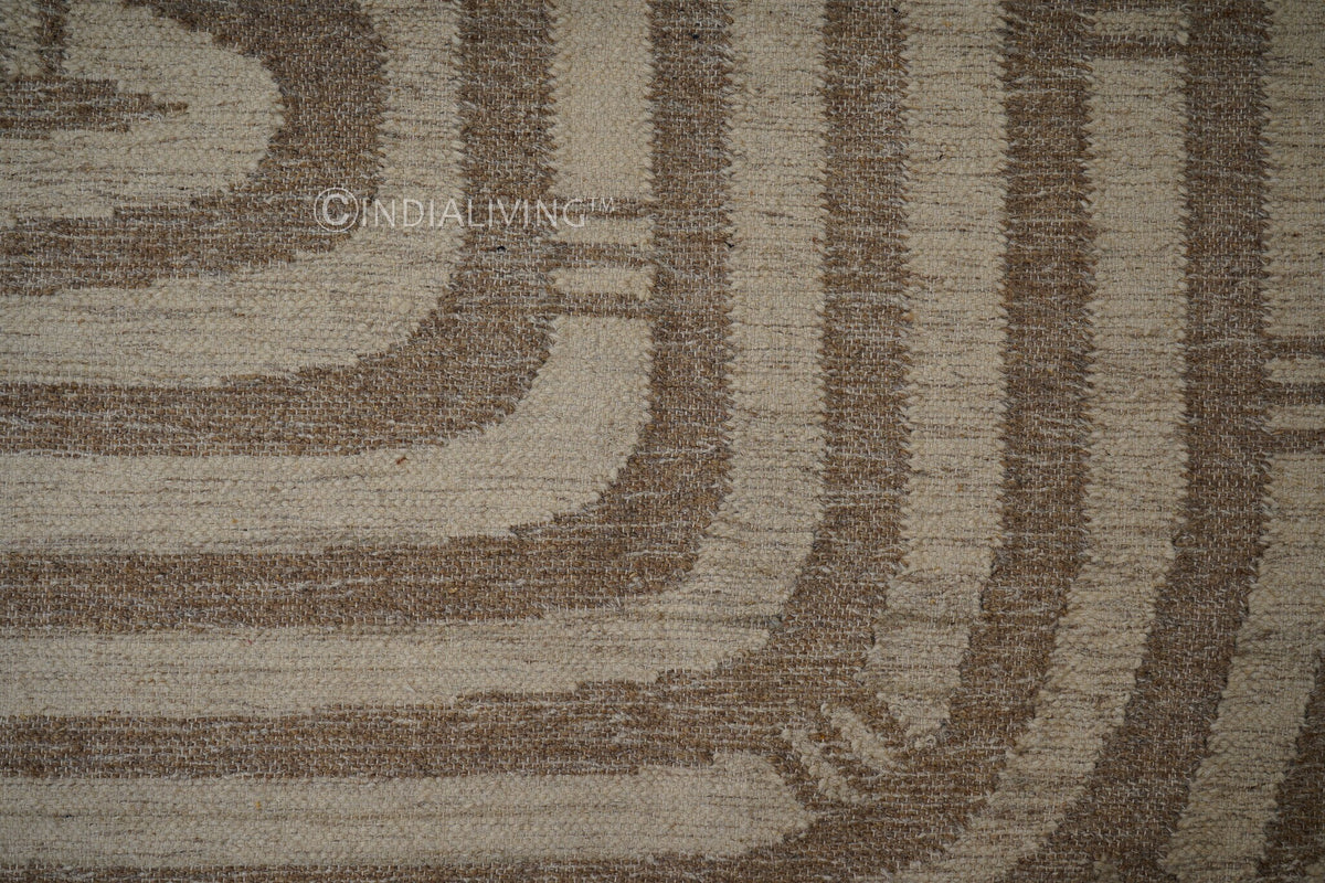 Fringe and braided edge detail of wool kilim rug