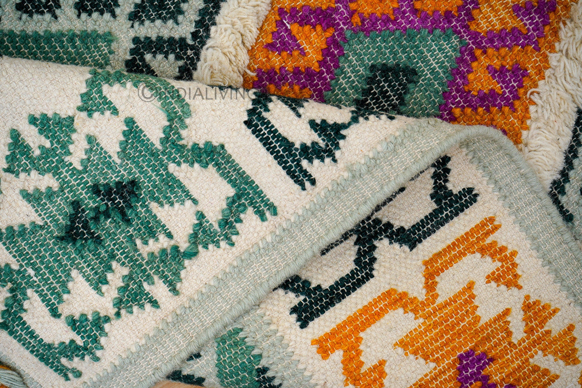 Green rug styled with boho furniture