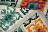 Green rug styled with boho furniture