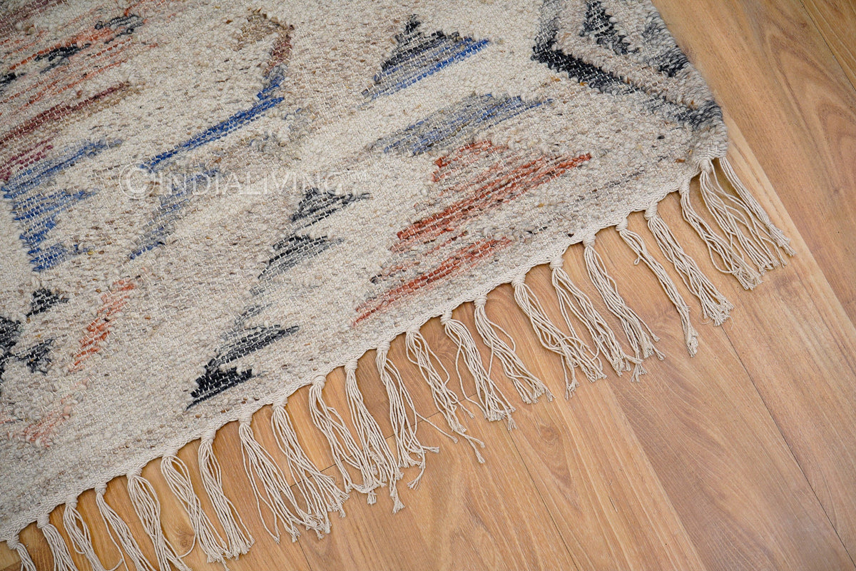 Beige abstract rug styled with minimalist furniture