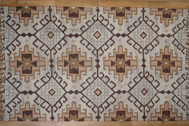 Brown beige kilim rug styled in a minimalist living room