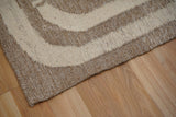 Wide shot of brown beige kilim rug on floor