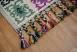 Wide shot of green Moroccan rug in a bright room