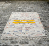 Beige rug edge and fringe close-up detail