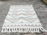 Interior design pink blue rug with geometric motifs