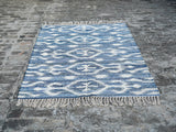 Denim blue rug in a Scandinavian-style room