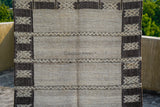 Farmhouse rug styled with rustic furniture