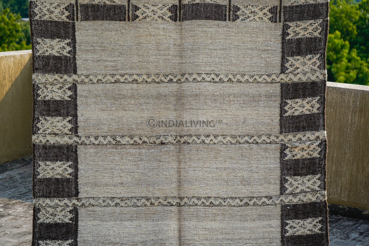 Farmhouse rug styled with rustic furniture