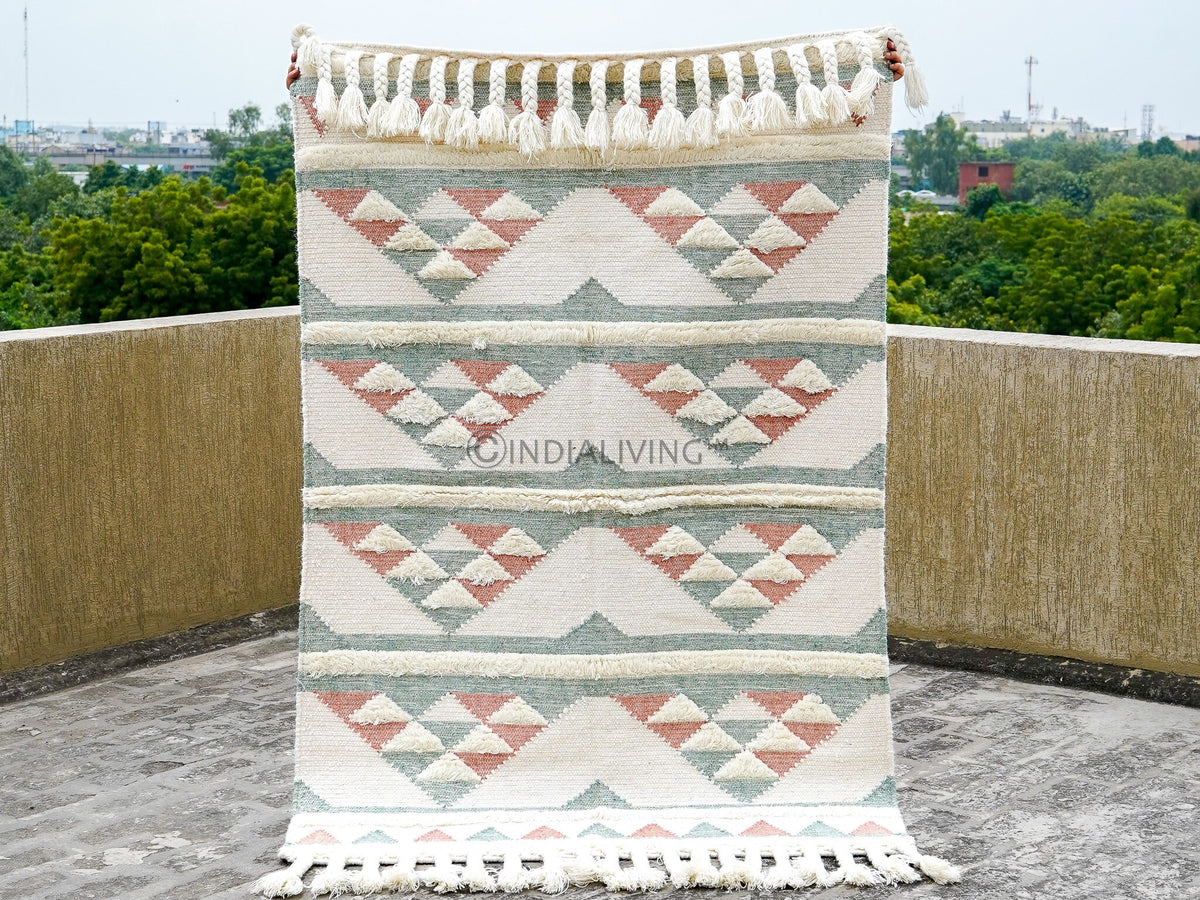Pink blue wool rug made by artisans, texture detail