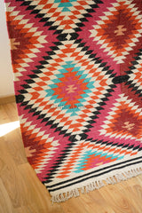 Rainbow kilim rug in a living room with furniture
