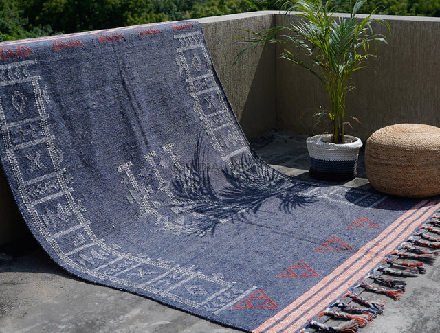 Blue kilim rug styled in a living room