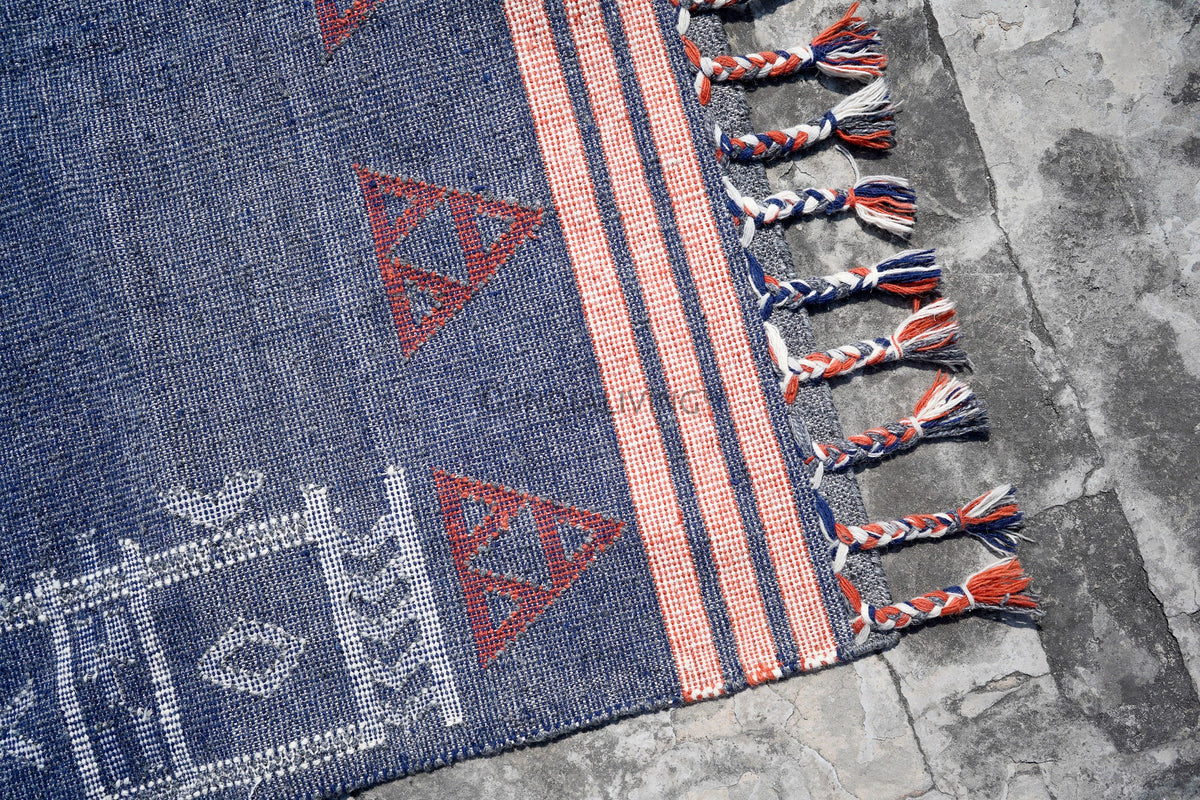 Full top-down view of oversized blue rug
