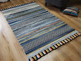 Blue striped kilim rug styled in a living room