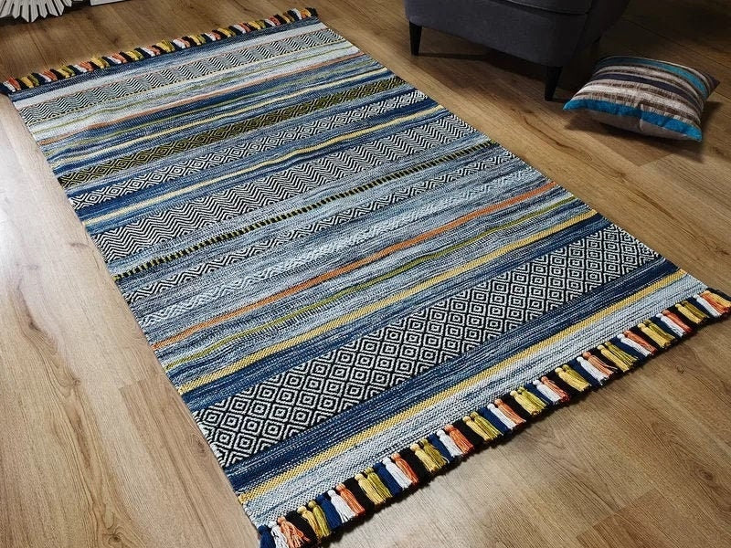 Blue striped kilim rug styled in a living room