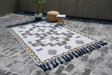 Full view of tribal kilim rug in natural light