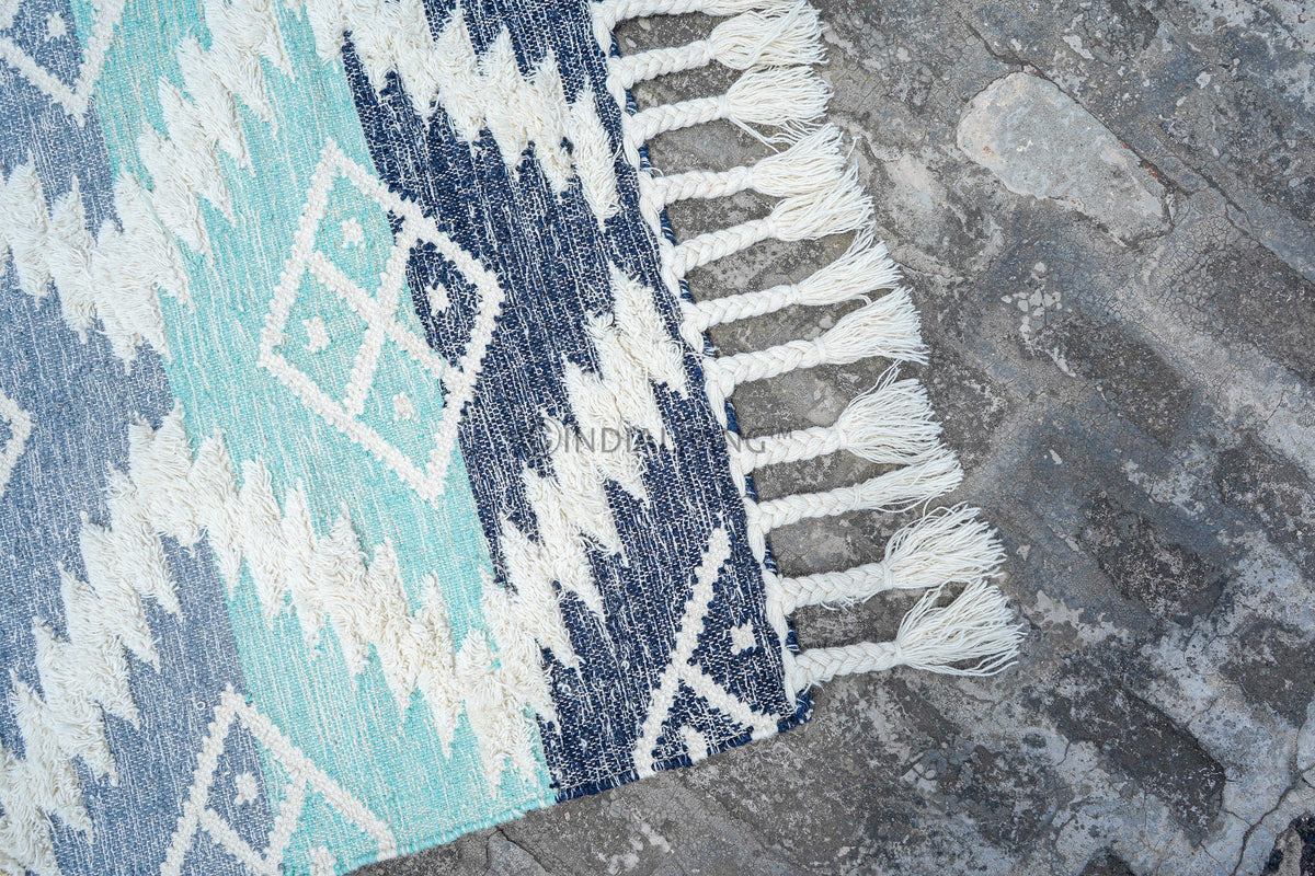 Colourful kilim shag rug corner detail with braided edge