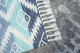Colourful kilim shag rug corner detail with braided edge