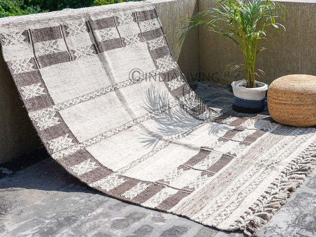 Farmhouse kilim rug styled in a rustic living room