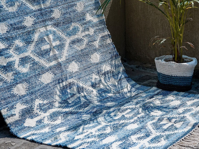 Denim blue rug styled in a living room