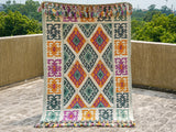 Green Moroccan tribal wool rug, flat lay view