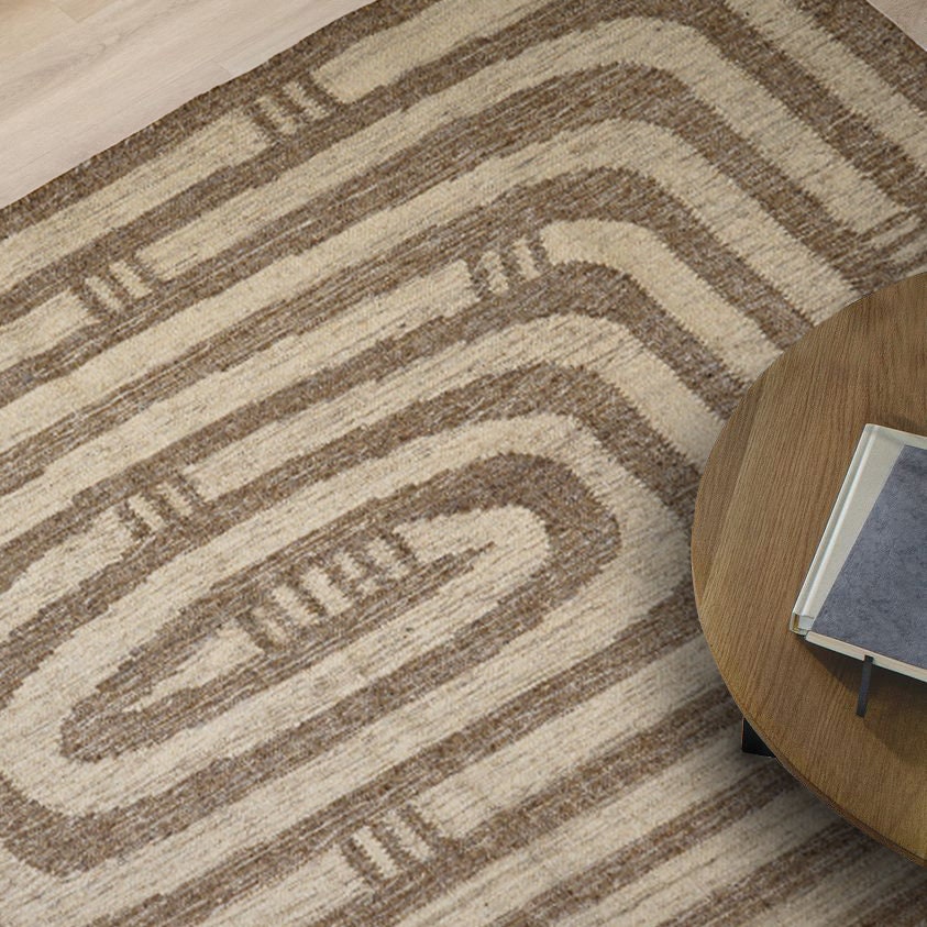 Neutral kilim rug in a bedroom setting