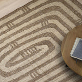 Neutral kilim rug in a bedroom setting