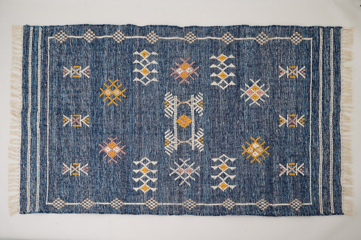 Aztec kilim rug styled in entryway