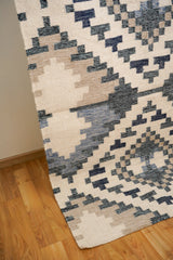 Beige blue wool rug texture close-up