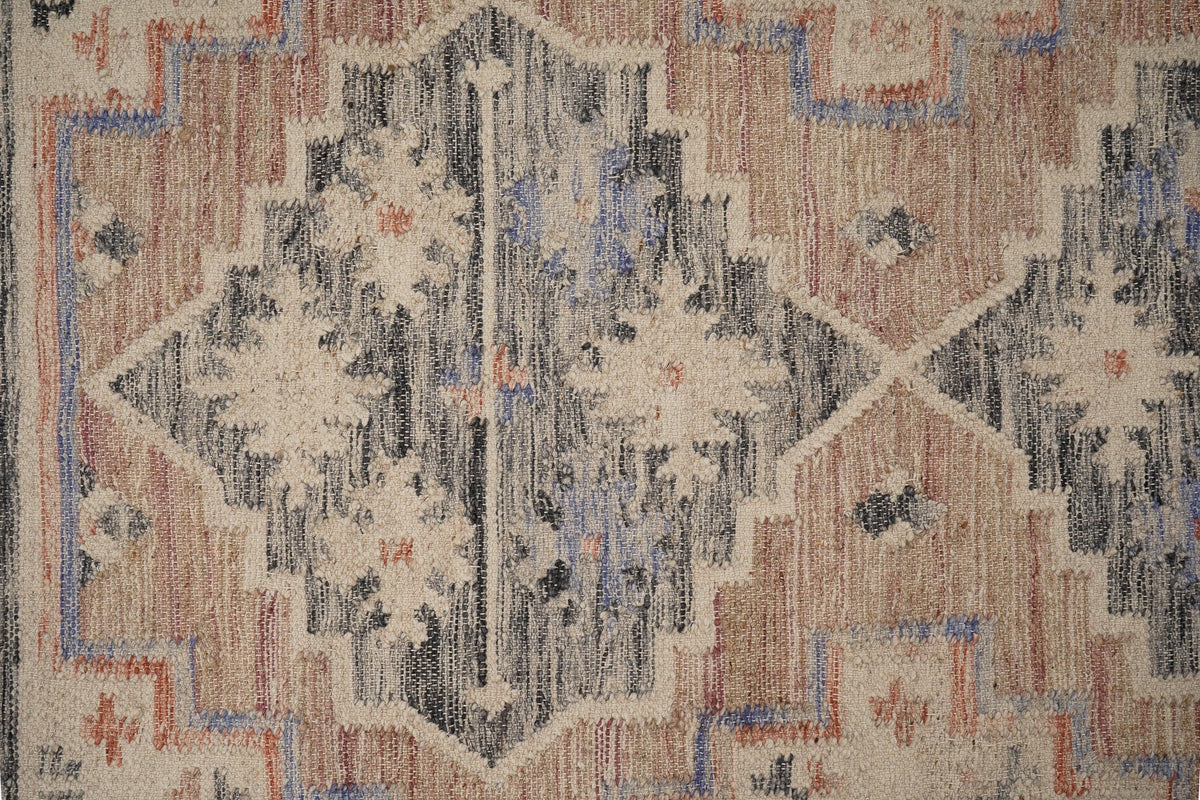 Pink vintage kilim rug styled with antique home decor
