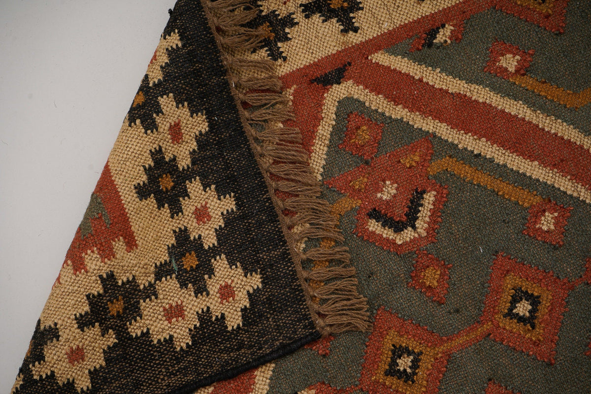 Corner detail of handwoven kilim runner fringe