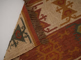 Red Navajo kilim runner texture close-up of wool-jute weave