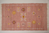 Close-up of pink kilim rug tribal pattern