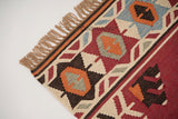 Red kilim rug edge and fringe detail