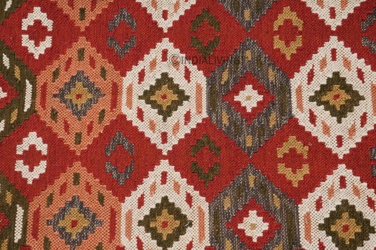 Red traditional kilim rug corner detail