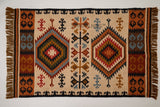 Beige southwestern kilim rug in living room