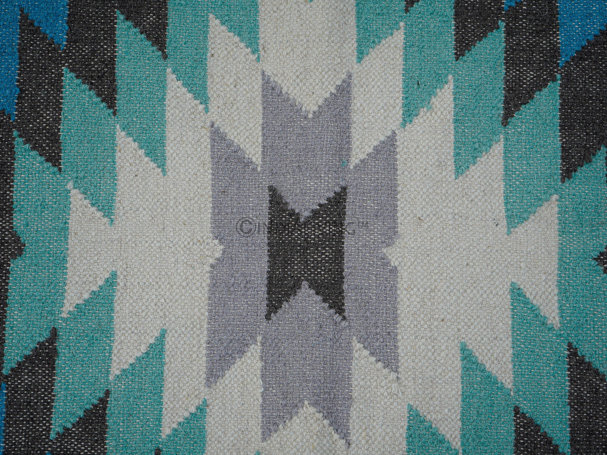 Blue wool runner rug in an entryway setting