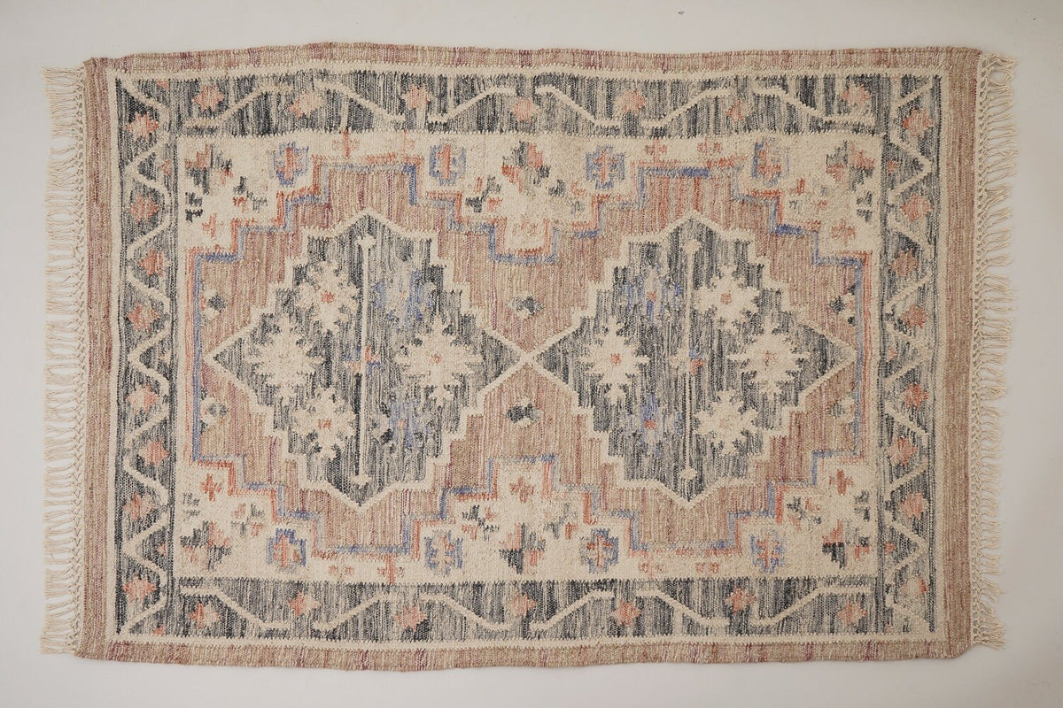Pink kilim rug shown in 5x8 size