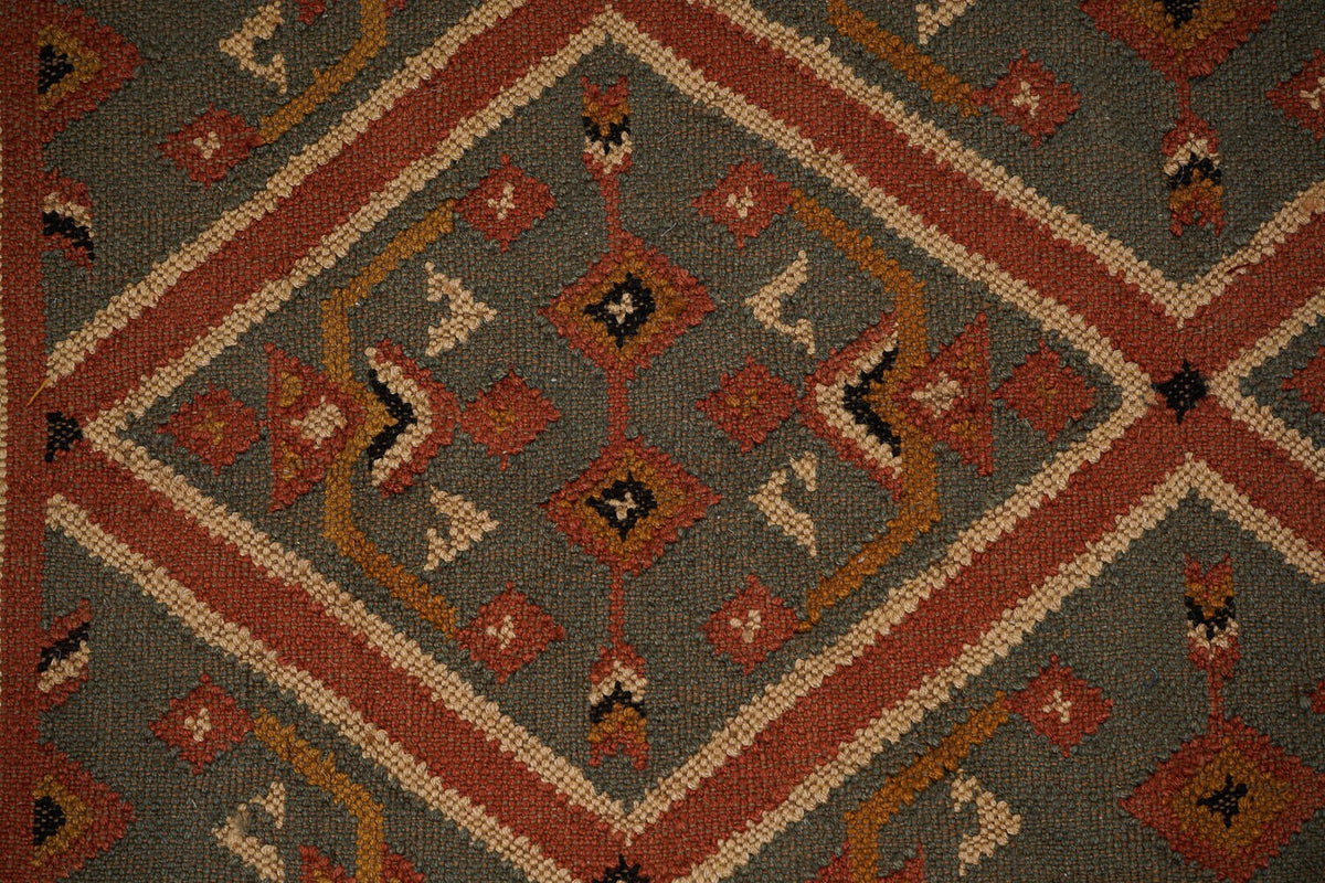 Wide shot of Aztec kilim runner on hardwood floor