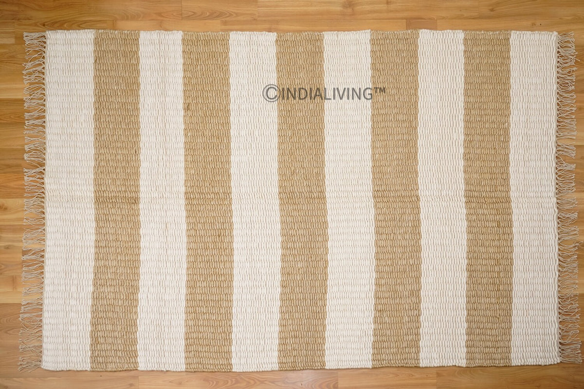 Ivory beige striped wool rug in a bedroom setting