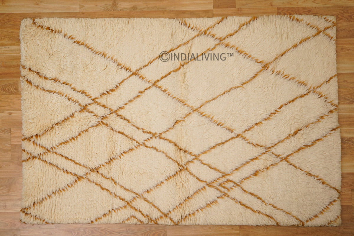 Ivory rug placed under furniture in bedroom