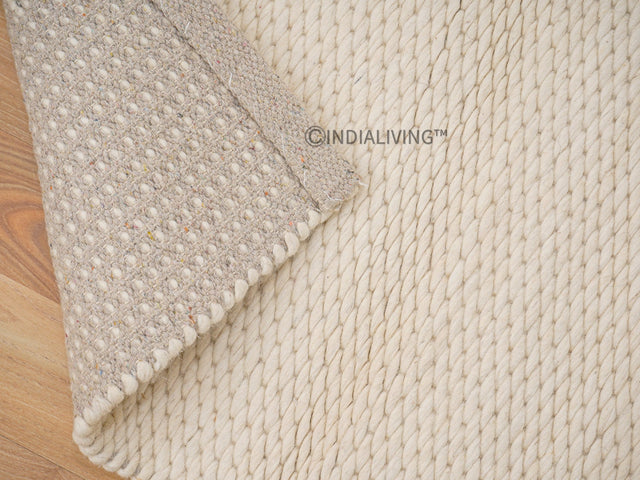 Ivory chunky loop wool rug flat lay