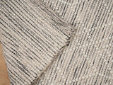 Beige textured chunky wool rug flat lay